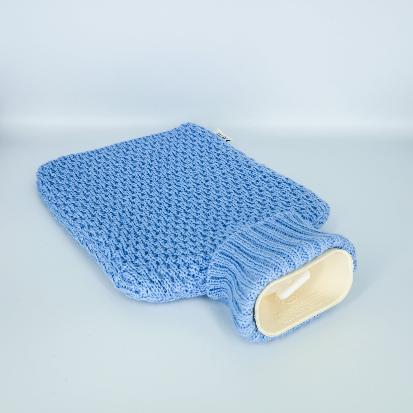 Bouillotte à eau version Jersey : conserve la chaleur pendant 8 heures